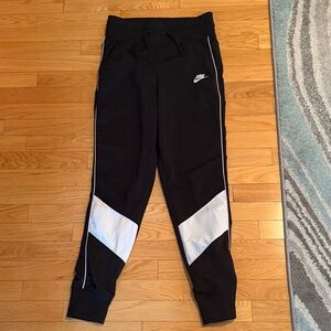 Nike woman’s Black Joggers with White Stripes